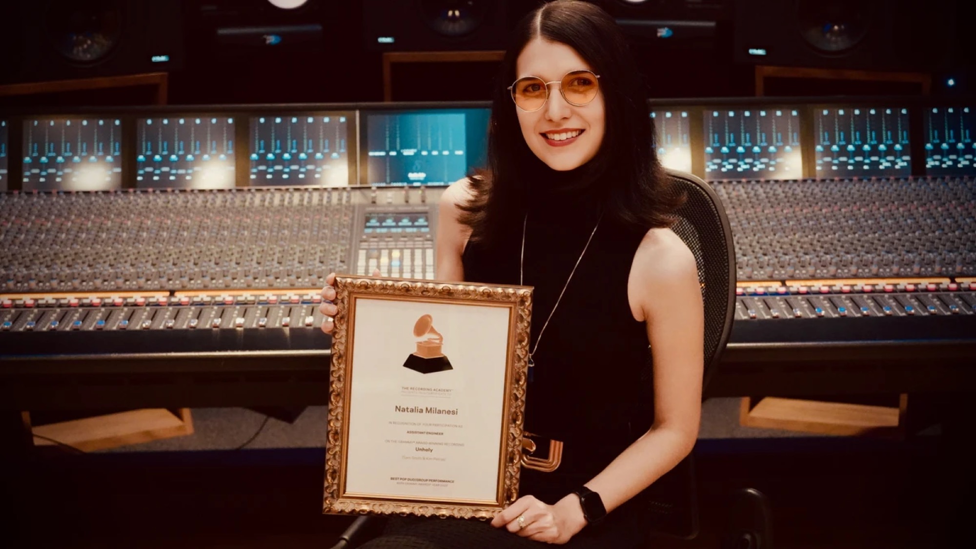 Natalia Milanesi holding her Grammy Award